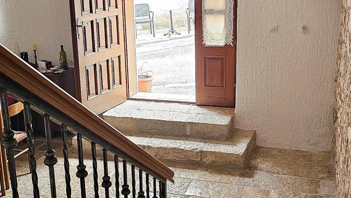 Entrance and stone staircase of the house
